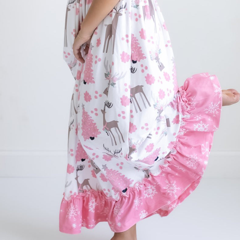 Girls' pink deer Christmas lounge gown with festive print and pink ruffle details.