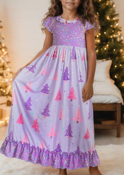 Girl wearing a purple Christmas tree lounge gown with pink holiday print and ruffle trim.